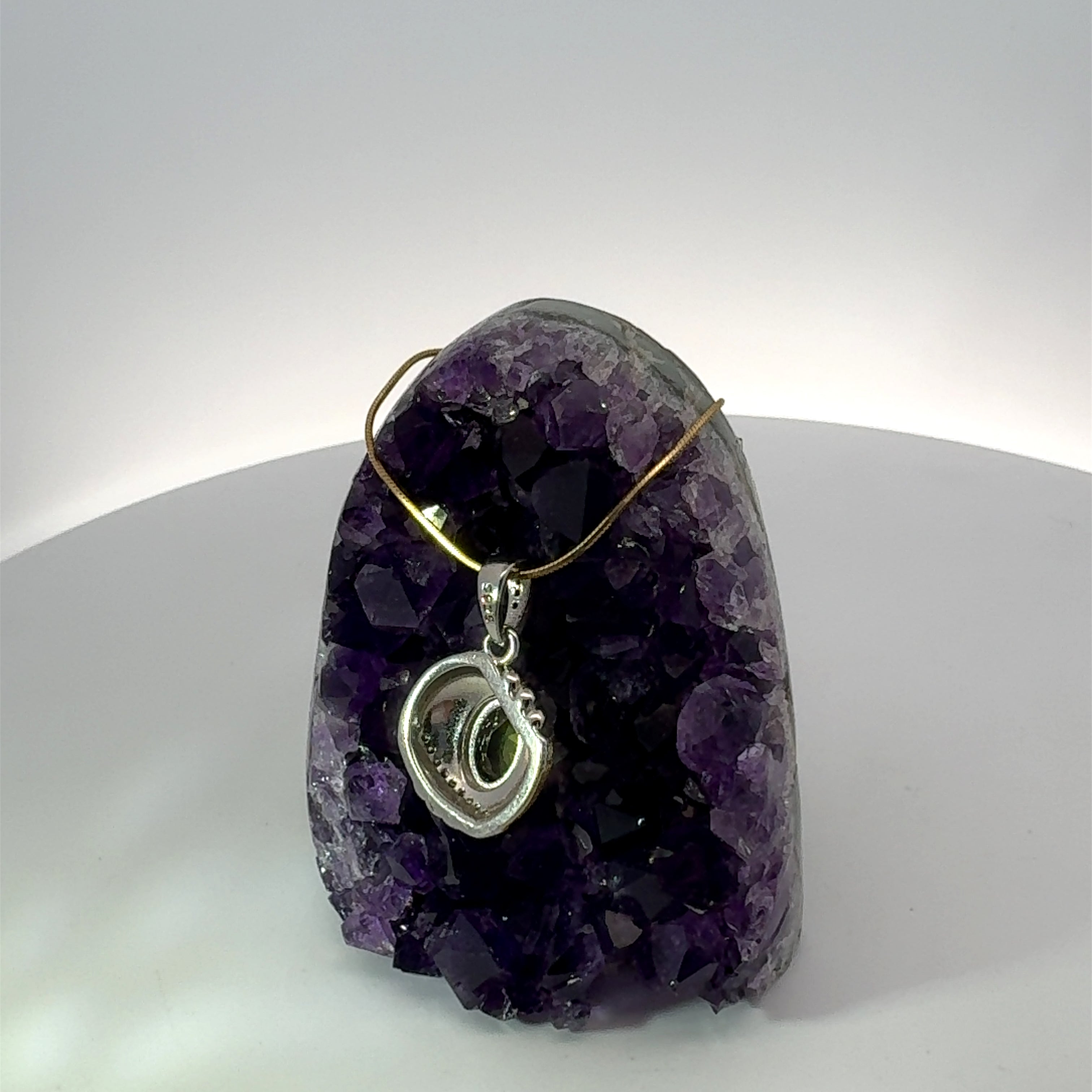 Oval Cut Peridot and Cz Circle Necklace in Sterling Silver accented by Gold